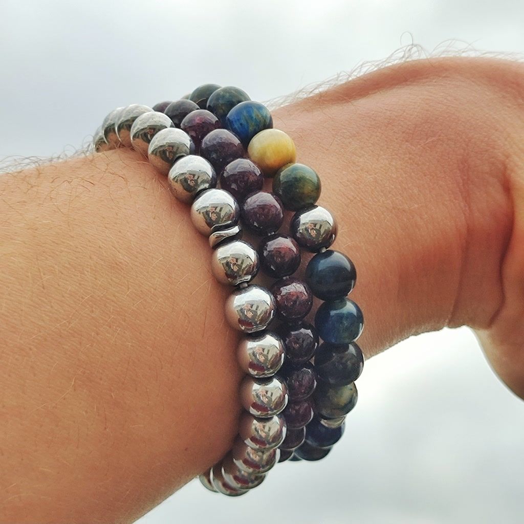 Handmade multi-stone bracelets featuring Hematite, Garnet, and Tiger Eye beads.